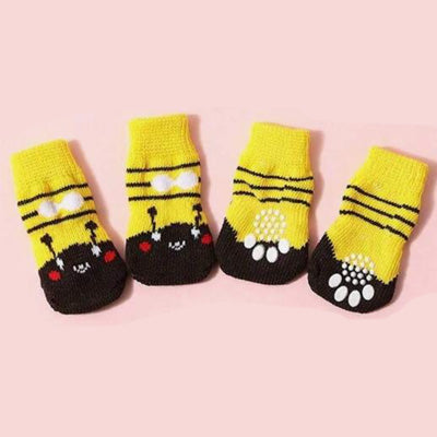 Pair of yellow and black small dog's socks with cartoon face design