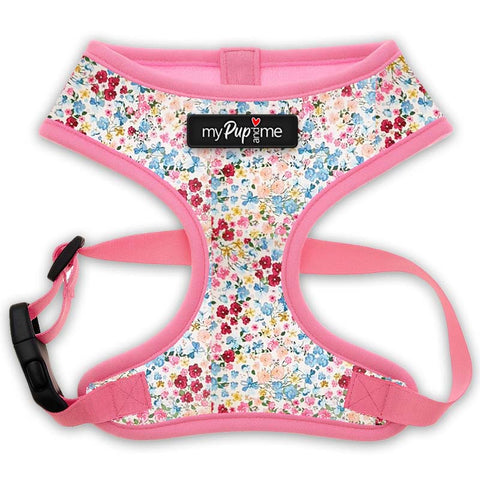 Floral-patterned dog harness with pink trim on a white background