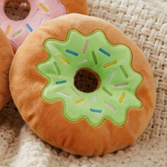 Matcha iced Donut-shaped plush toy with colorful sprinkles on a plush velour fabric